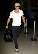 http://img101.imagevenue.com/loc103/th_86213_Kellan_Lutz_arrives_at_LAX2_122_103lo.jpg